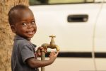 1280px-A_child_waits_outside_a_medical_clinic_as_part_of_Western_Accord_2012_in_Thies_Senegal_June_10_2012_120610-Z-KE462-197-1024×680