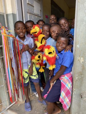 children by the door with zeds and stick copy